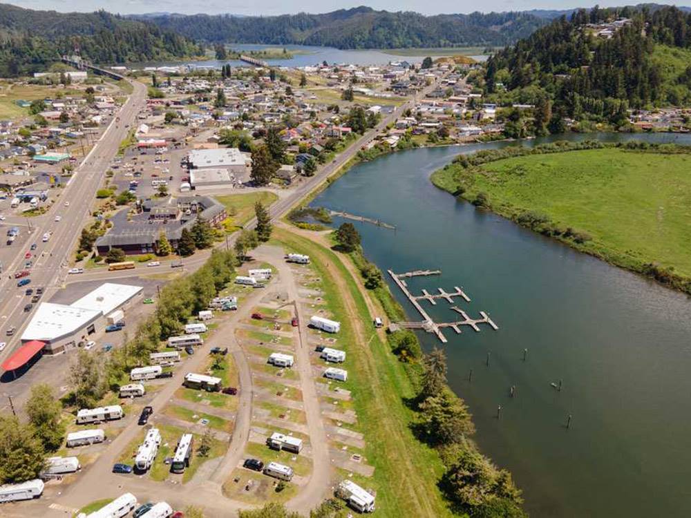 RV campground with docks on the banks of a river at COHO RV PARK & MARINA
