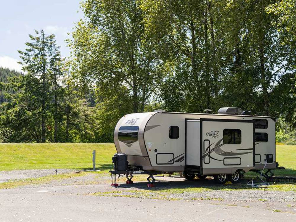 Travel trailer with slide out deployed on site at COHO RV PARK & MARINA