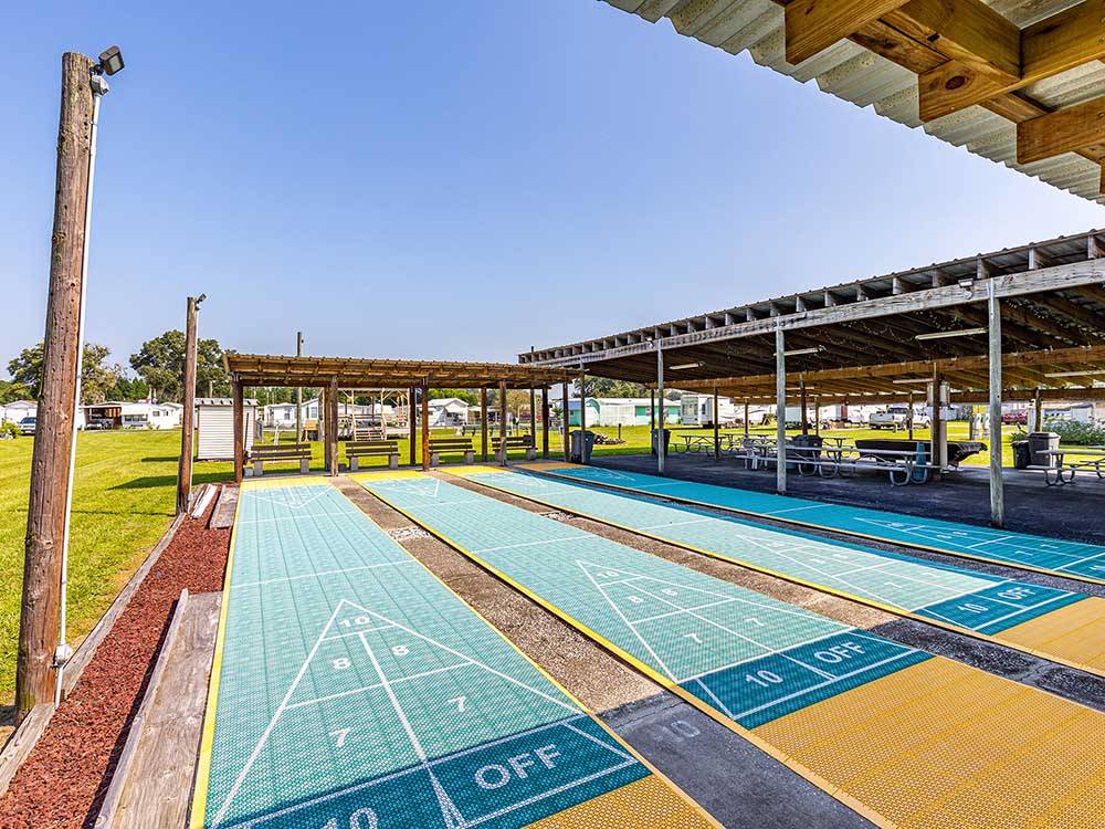 Four rows of shuffleboard courts at SANDBAR RV RESORT