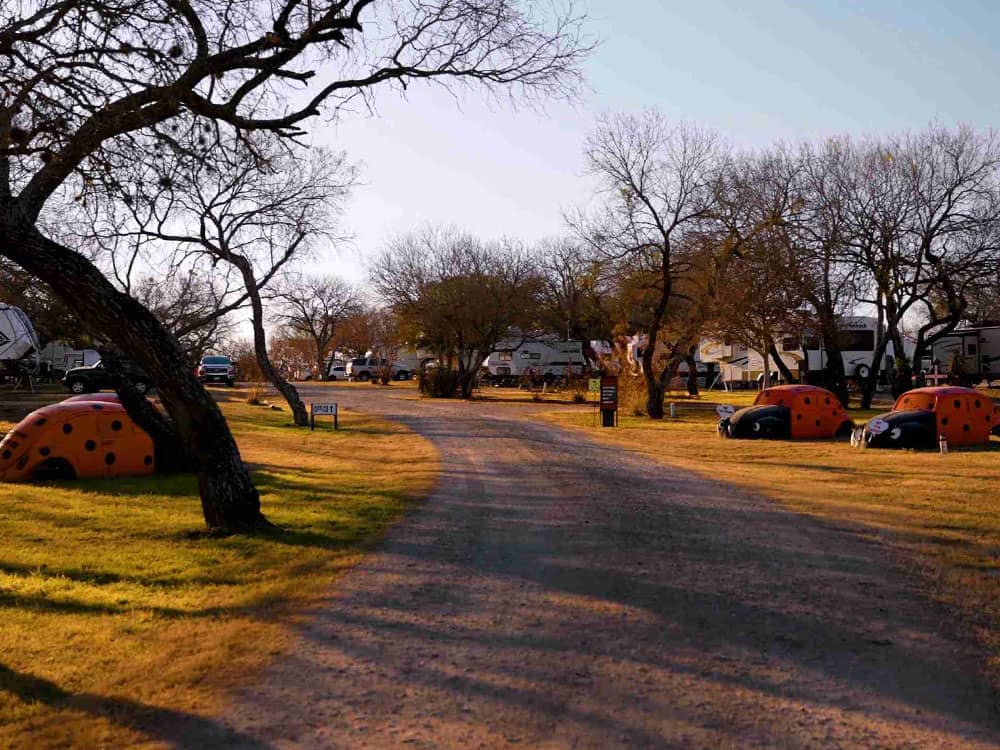 Road through campground lots with RVs