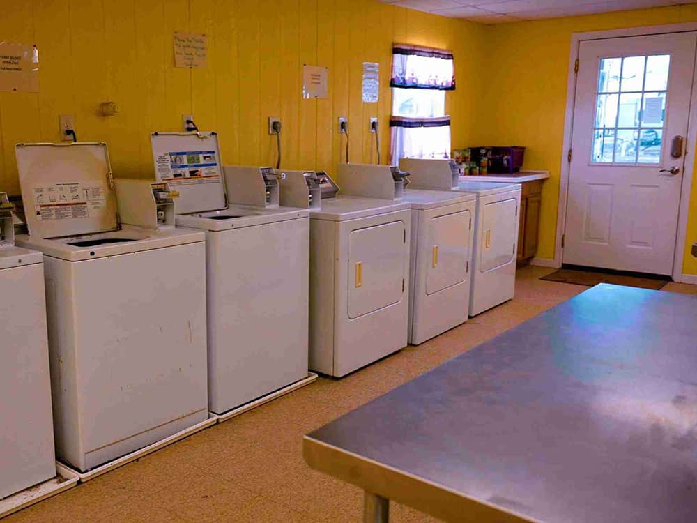 Interior of laundry building showing washers and dryers