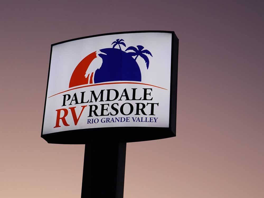 The front entrance sign at PALMDALE RV RESORT
