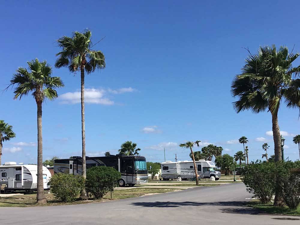 A row of paved RV sites at PALMDALE RV RESORT