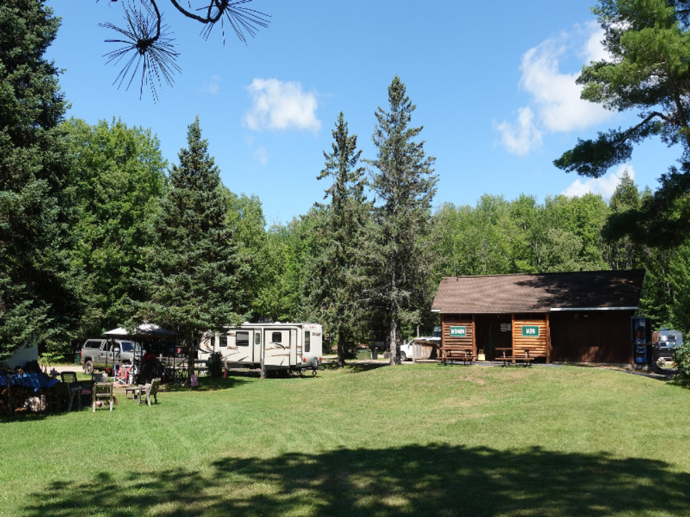 trailer in grassy site at Otter Lake Campground