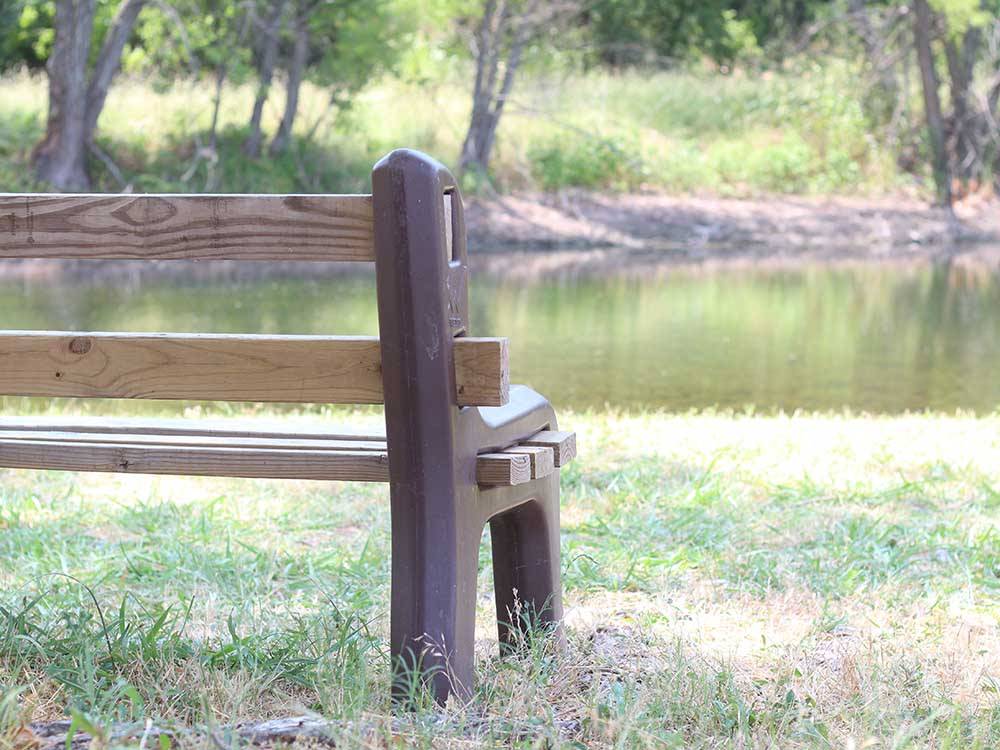 Bench looking out on water at BLUE SKY I-35 RV PARK