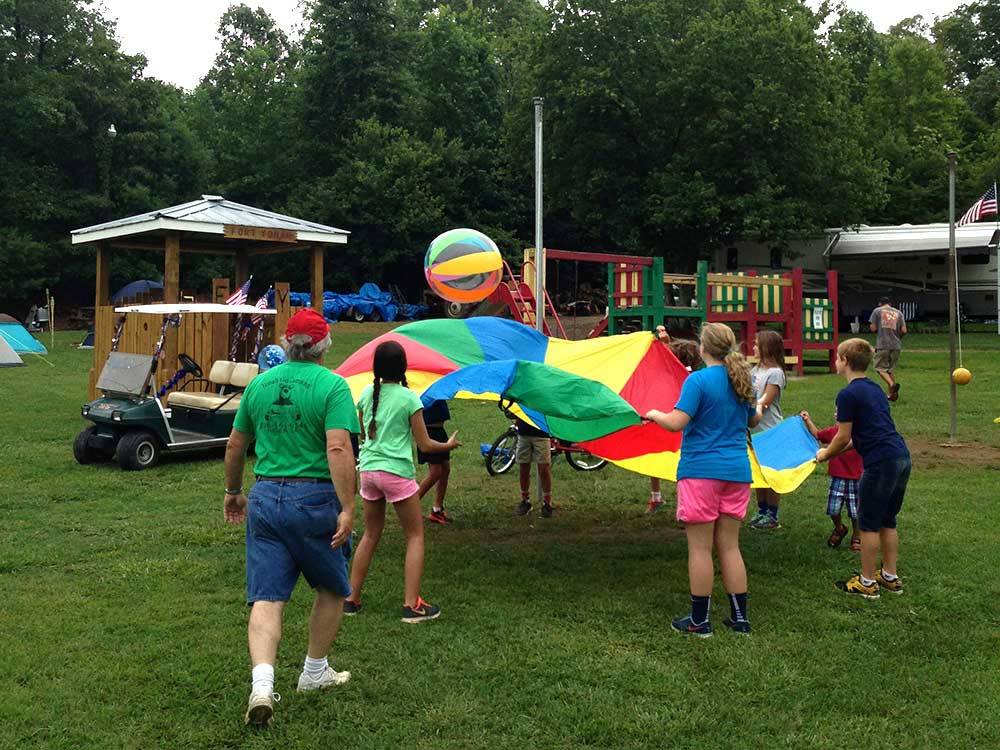 People playing games on the playground at YONAH MOUNTAIN CAMPGROUND