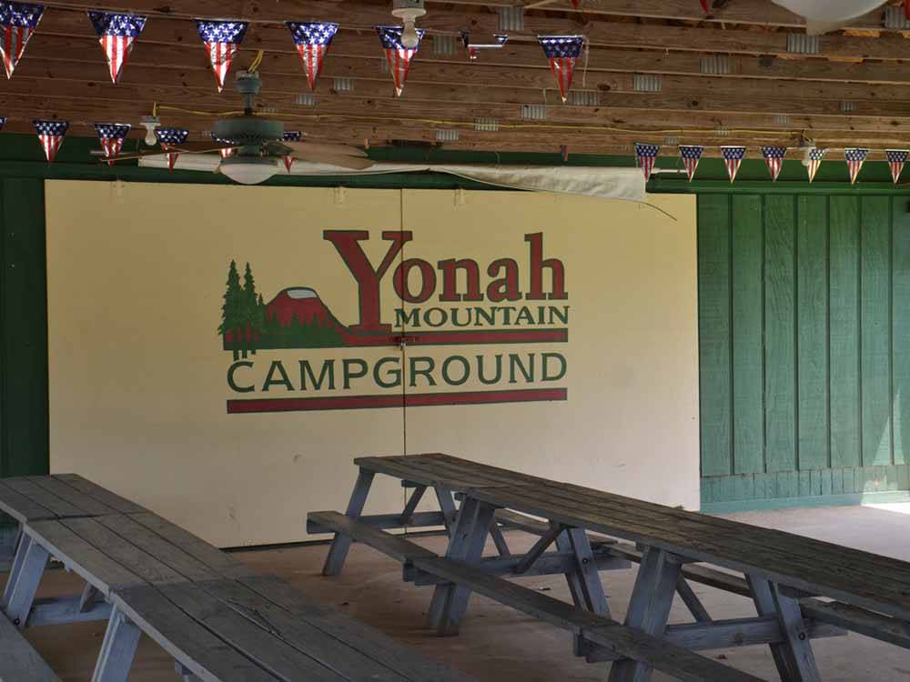 A row of picnic benches at YONAH MOUNTAIN CAMPGROUND