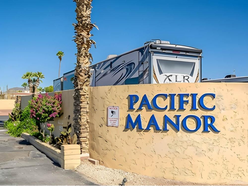 Welcome sign at site Pacific Manor