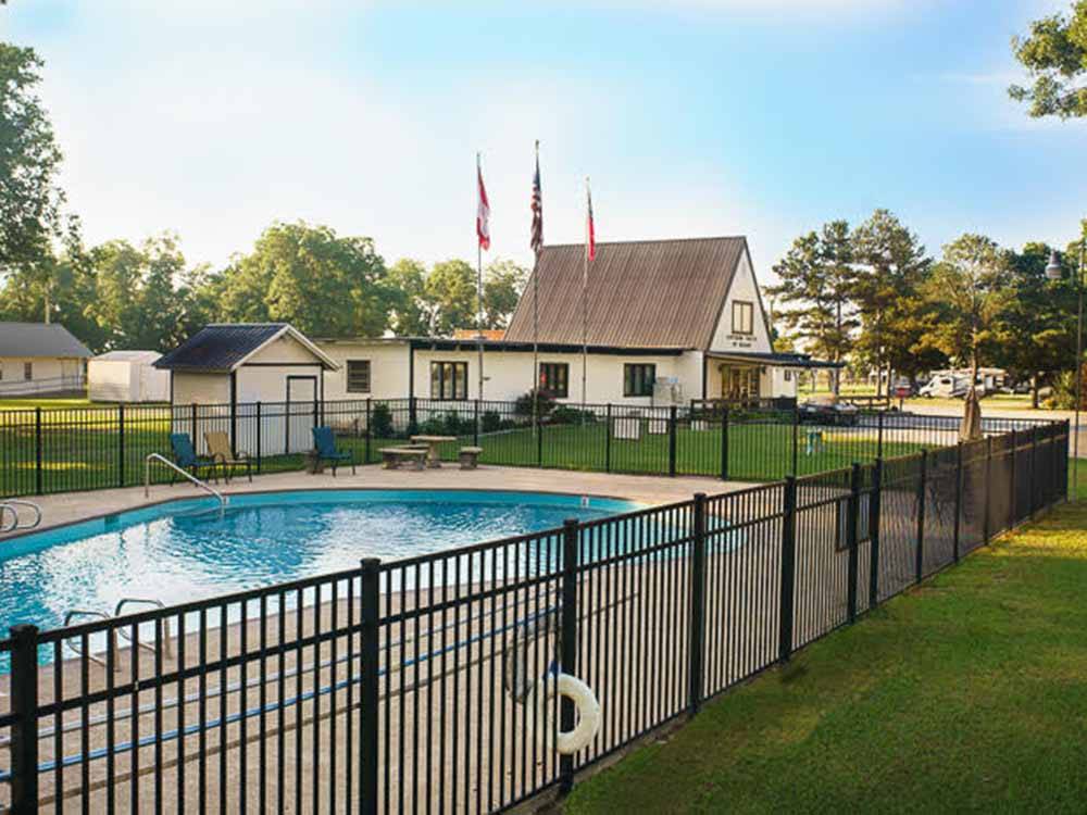The fenced in swimming pool at SOUTHERN TRAILS RV RESORT