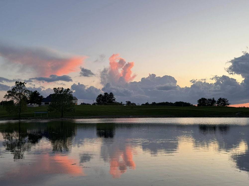 Sunset over the water at Heavenly Hills Resort