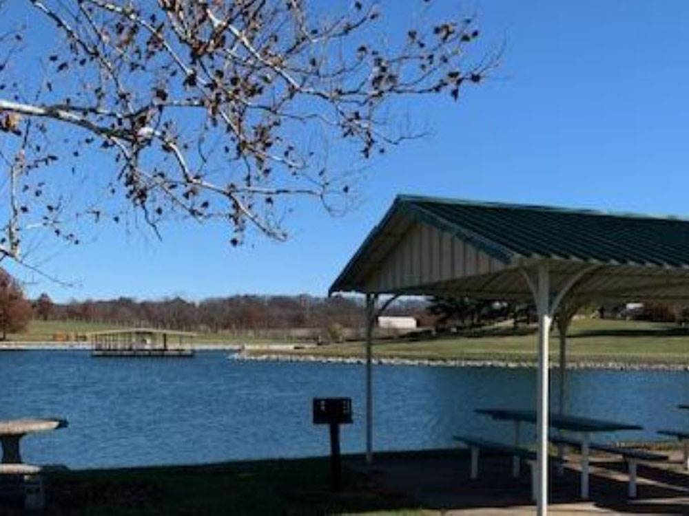 Covered picnic area by the water at Heavenly Hills Resort