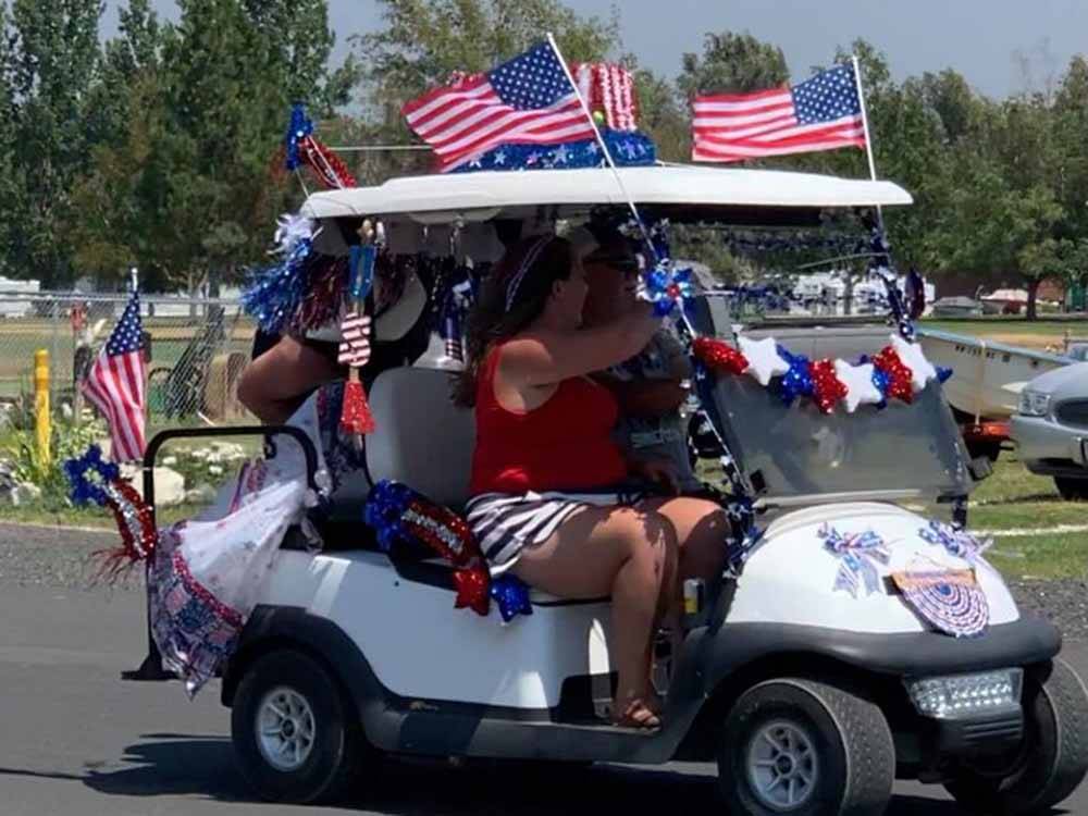 A golf cart in a 4th of July parade at O'SULLIVAN SPORTSMAN RESORT (CAMPING RESORT)