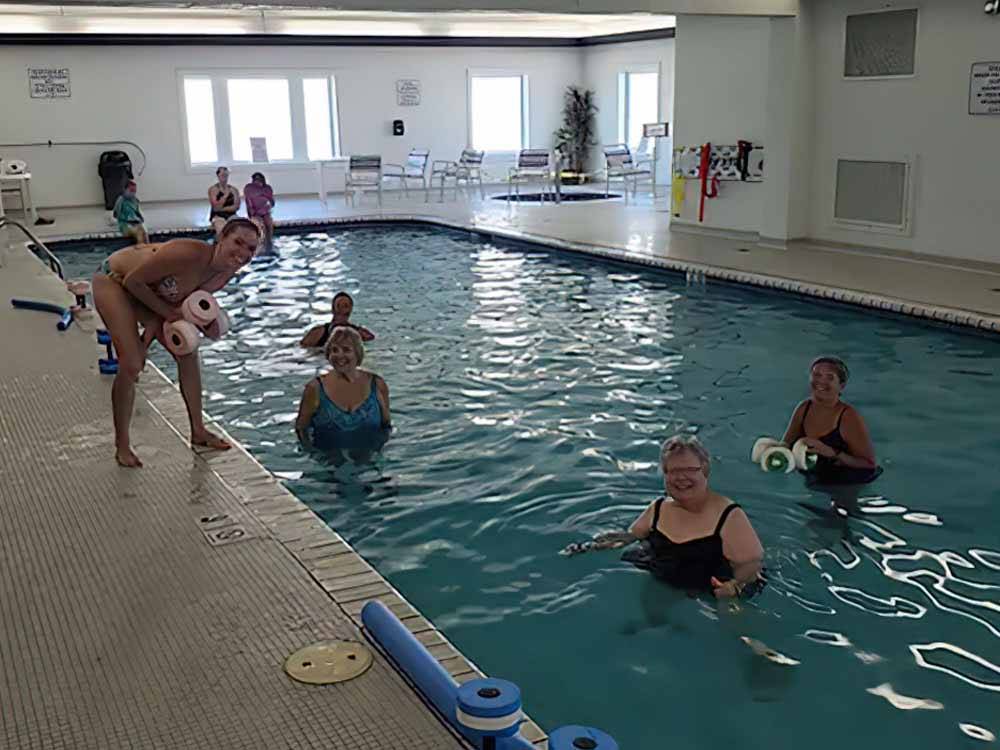 People exercising in the indoor swimming pool at THE RESORT AT ERIE LANDING