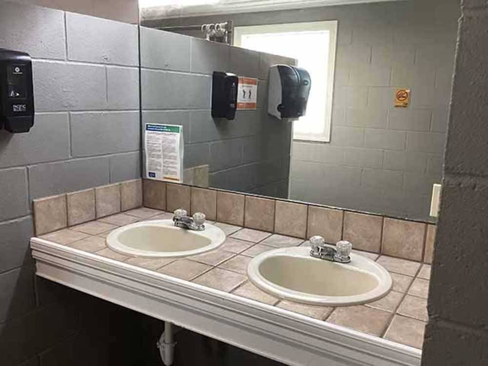 The clean bathroom sinks at WENDY OAKS RV RESORT