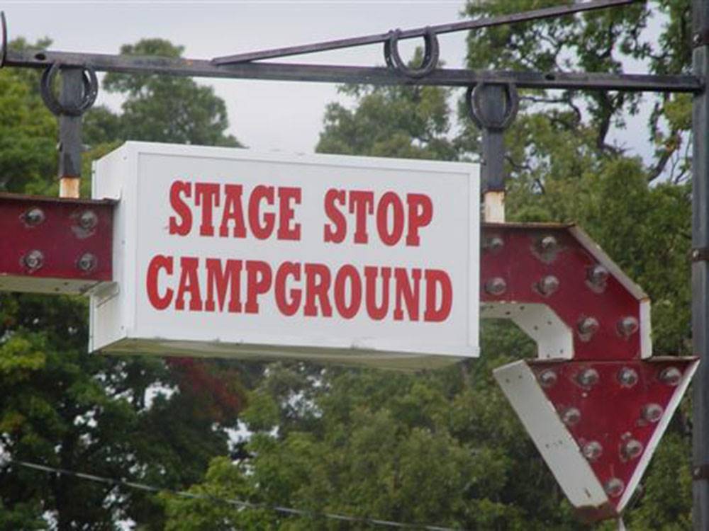 The campground name on a sign with an arrow