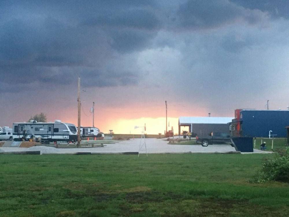 Travel trailers parked in sites at sunset