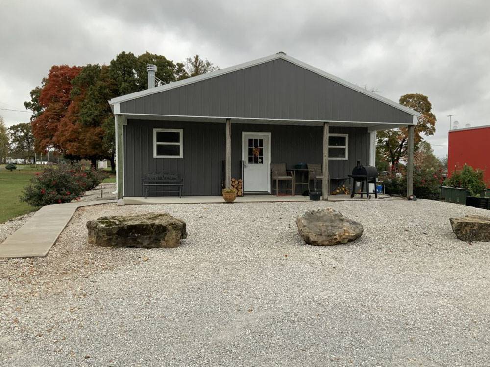 A rental with a bbq pit in the front