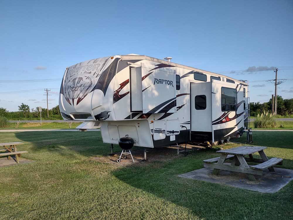 A fifth wheel parked on-site at BOLIVAR PENINSULA RV PARK