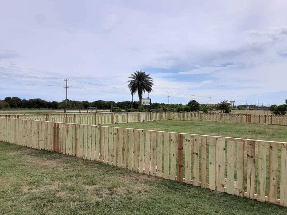 The fenced-in pet park at BOLIVAR PENINSULA RV PARK