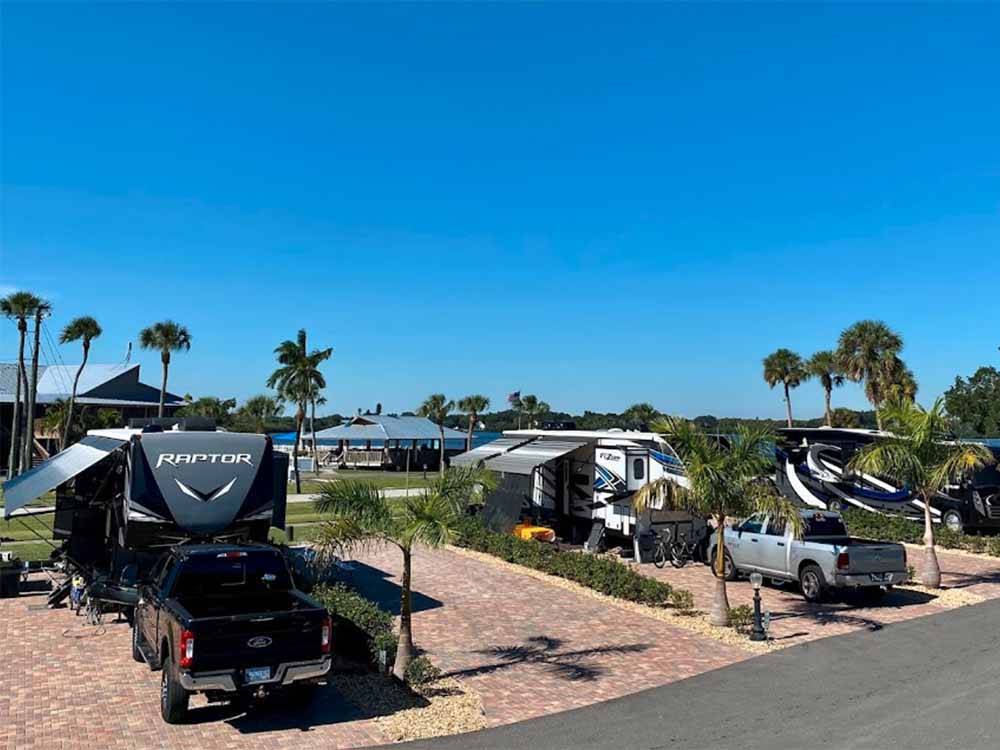 A row of back in RV sites at FISHERMAN'S COVE WATERFRONT RV RESORT