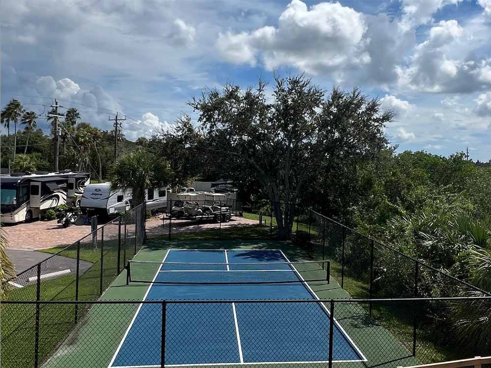 The blue pickleball court at FISHERMAN'S COVE WATERFRONT RV RESORT