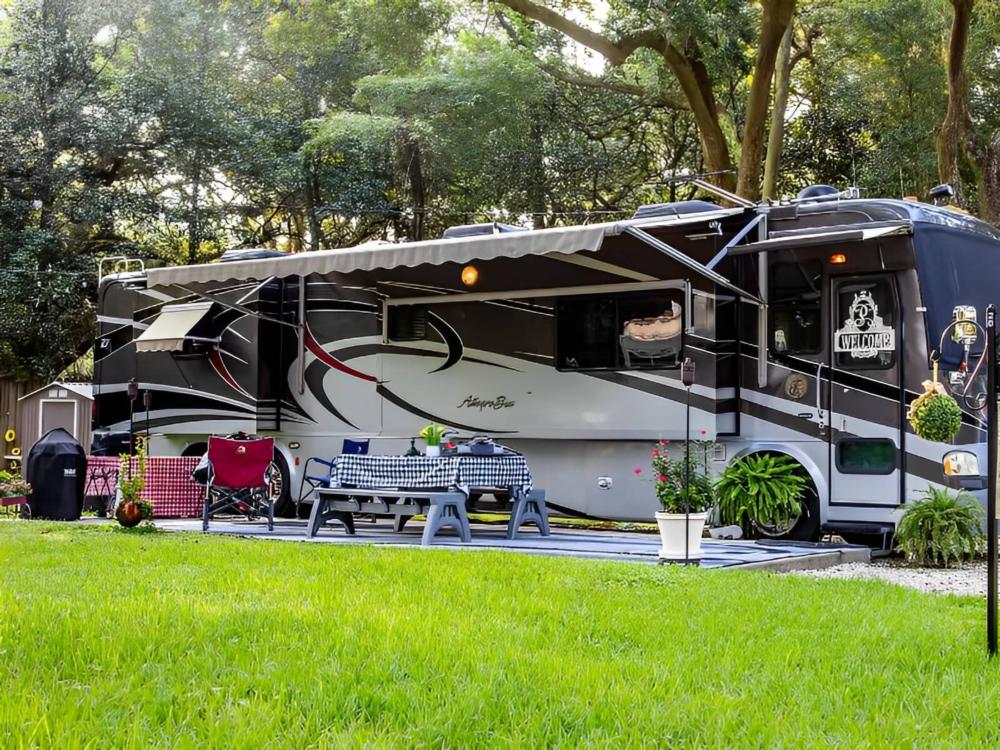 RV parked at site Mobile Oaks RV Resort