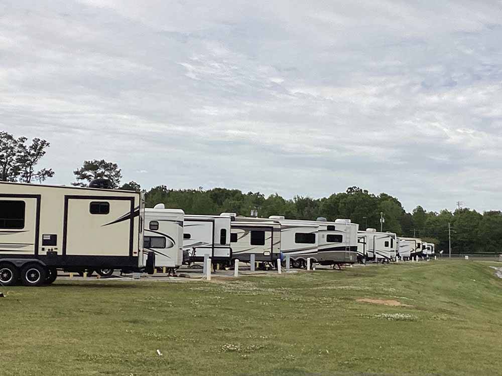 A row of RV sites by grass at LINCOLN CIVIC CENTER RV PARK
