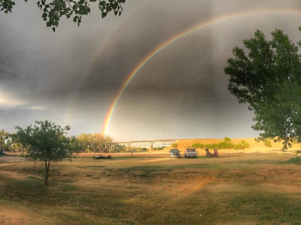 A rainbow over teh park
