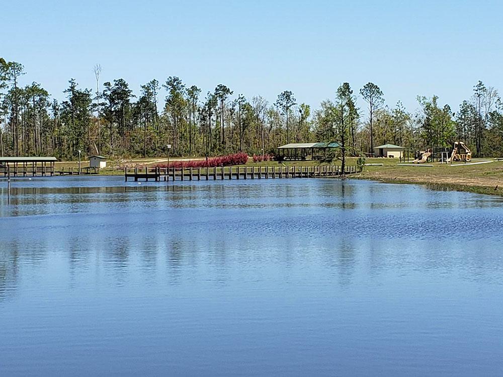 A view of the lake and the pier at DEAD LAKES PARK RV & CAMPGROUND