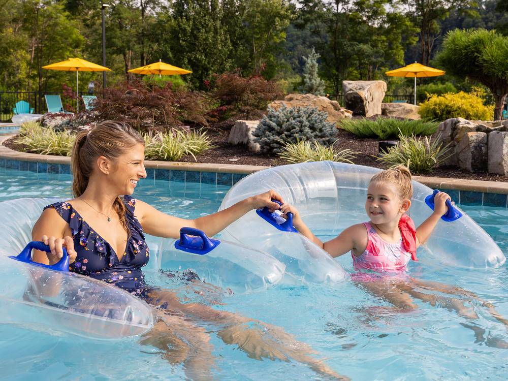 Mother and daughter in the lazy river at Pigeon Forge Department Of Tourism