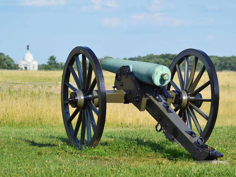 An old cannon in a grassy area at DESTINATION GETTYSBURG
