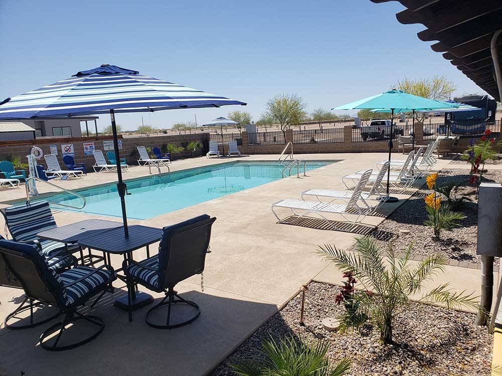 The swimming pool with seating at COPPER MOUNTAIN RV PARK
