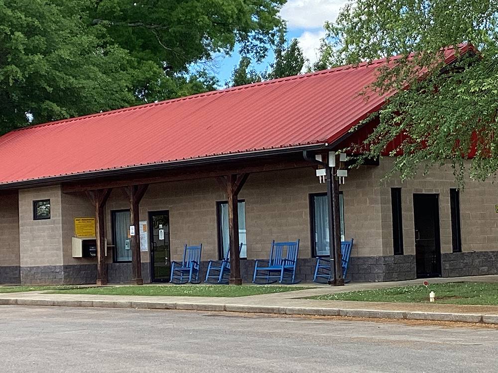 Office with rocking chairs in front at Camping World-Campground of Oxford