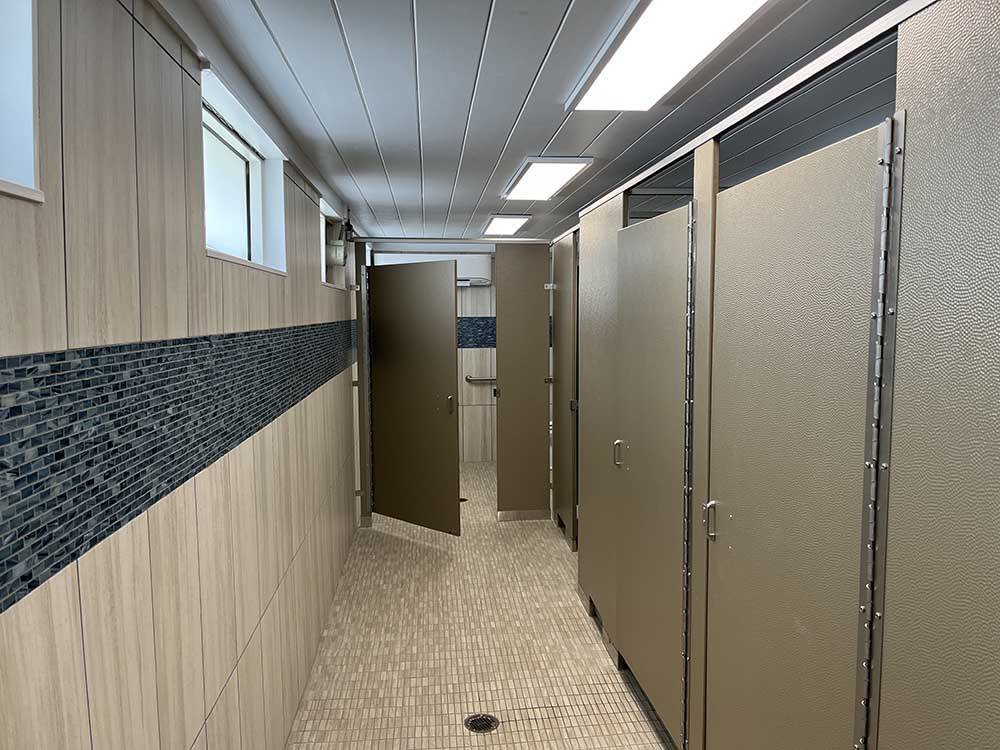 Public bathroom stalls at CORAL SANDS OCEANFRONT RV RESORT