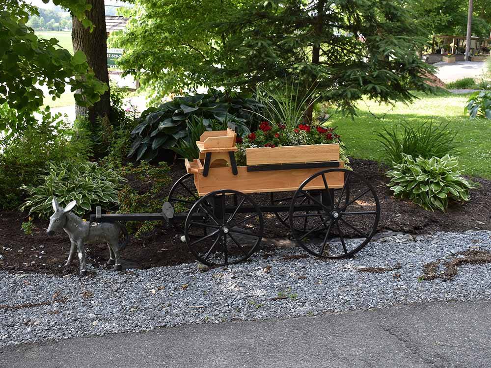 A wagon with a flower pot at OMA'S FAMILY CAMPGROUND