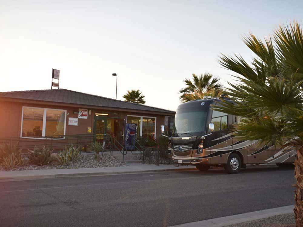 Motorhome parked in front of campground office at SUN RESORTS RV PARK