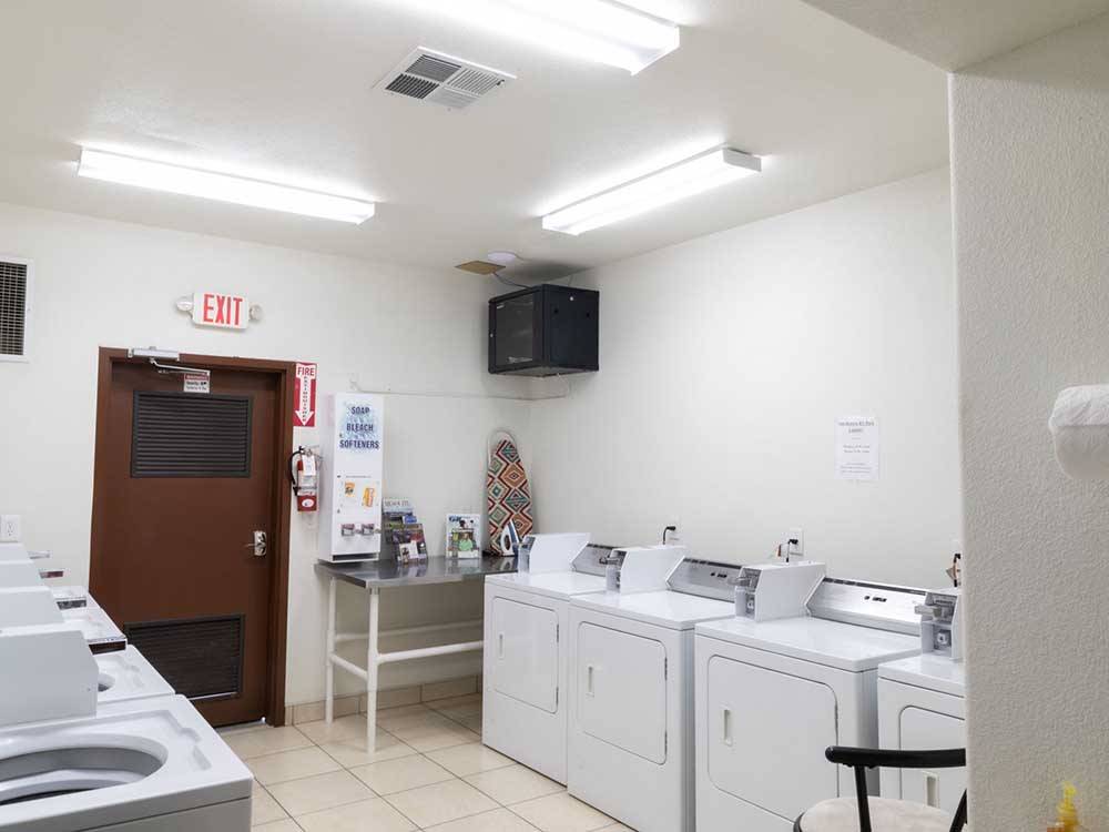 Laundry room with washers and dryers at SUN RESORTS RV PARK