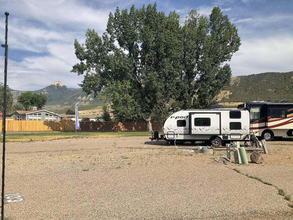A small travel trailer at a site