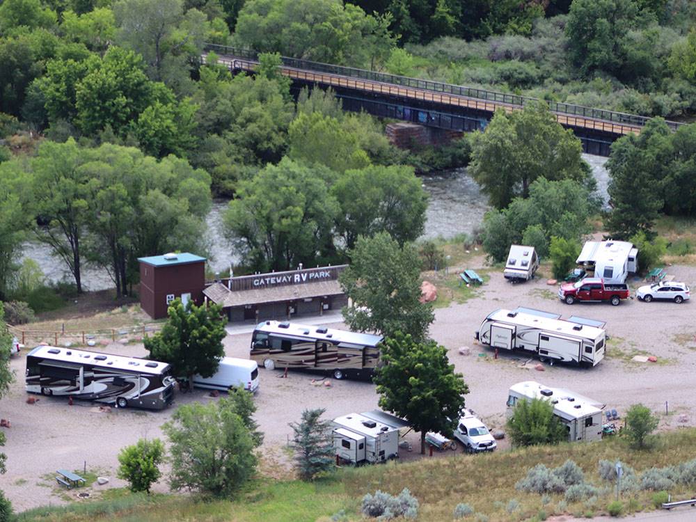 Motorhomes, travel trailers and fifth-wheels camped near river at GATEWAY RV PARK