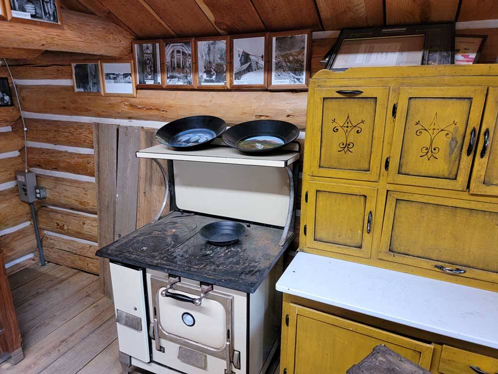 An old stove in a cabin at CRYSTAL GOLD MINE & RV PARK