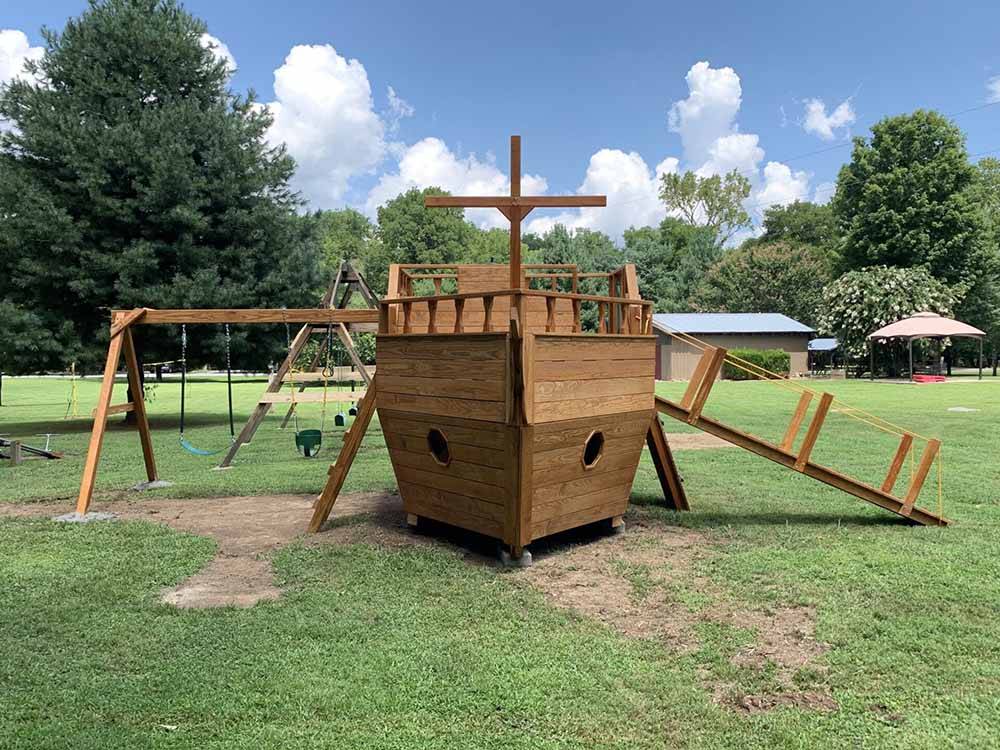 The wooden ship shaped playground equipment at TRIPLE CREEK CAMPGROUND