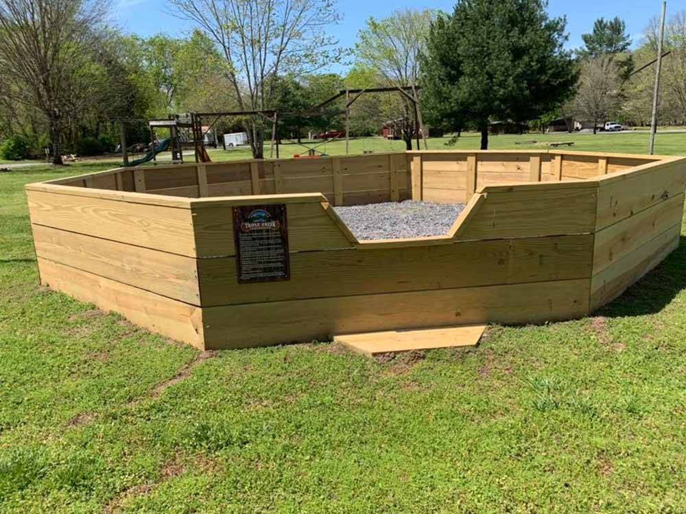 The wooden GaGa ball pit at TRIPLE CREEK CAMPGROUND