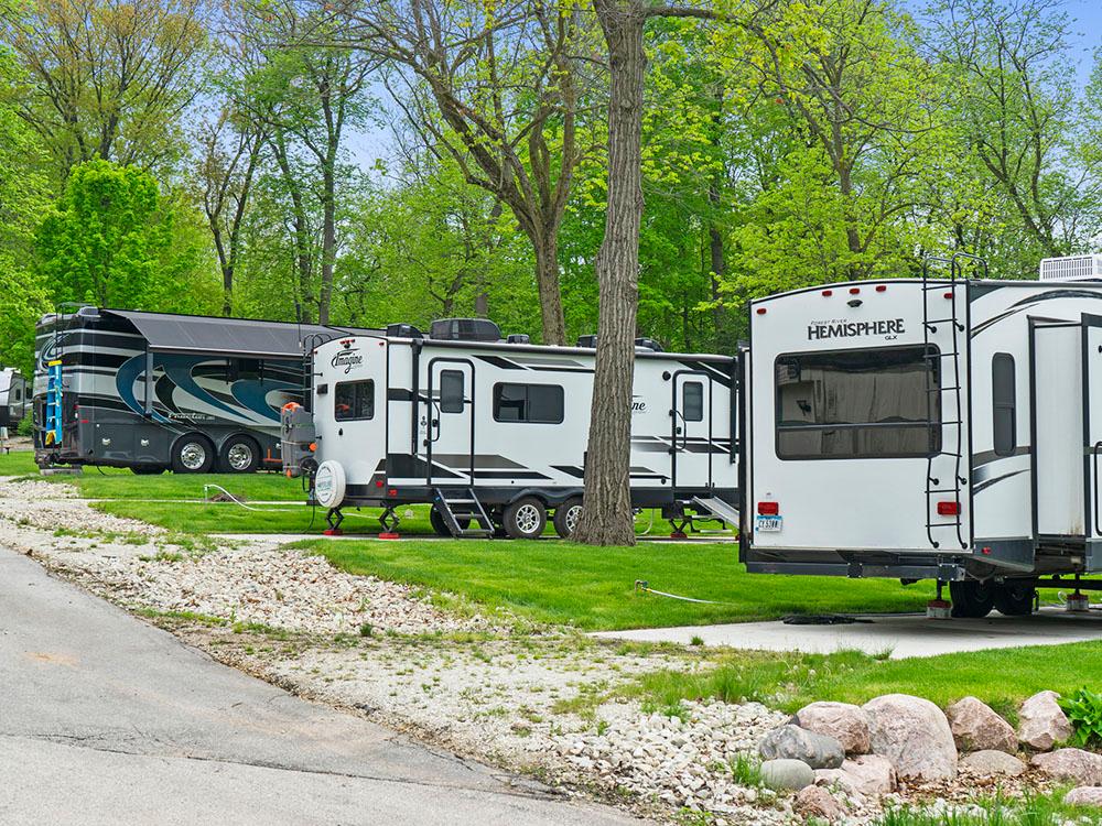 Travel trailers parked at paved sites at COACHMAN'S TERRACE RV PARK