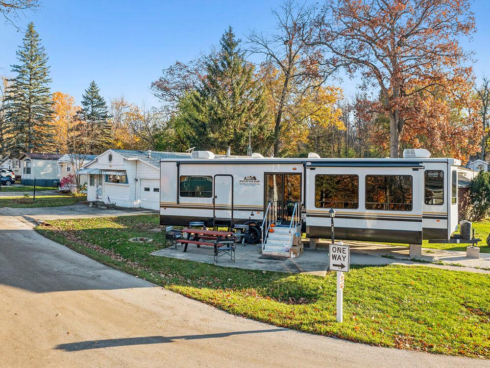 More travel trailers parked at paved sites at COACHMAN'S TERRACE RV PARK