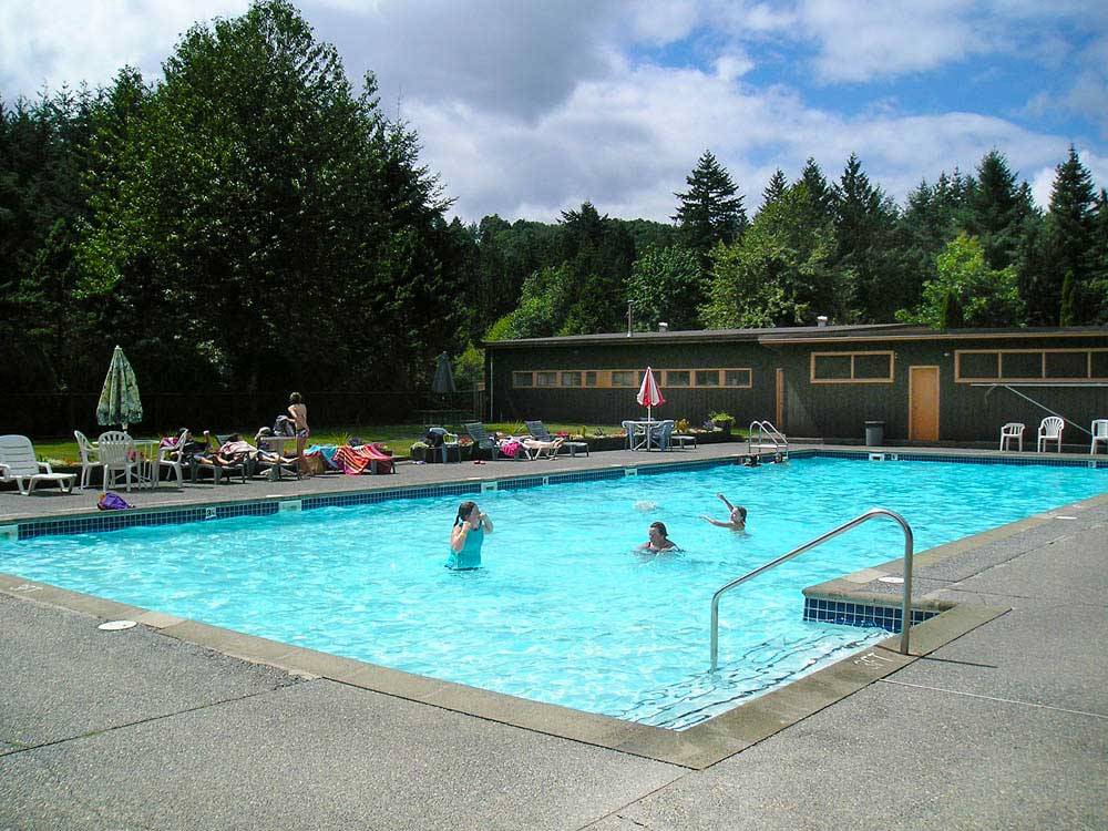 People swimming in pool at THOUSAND TRAILS CULTUS LAKE