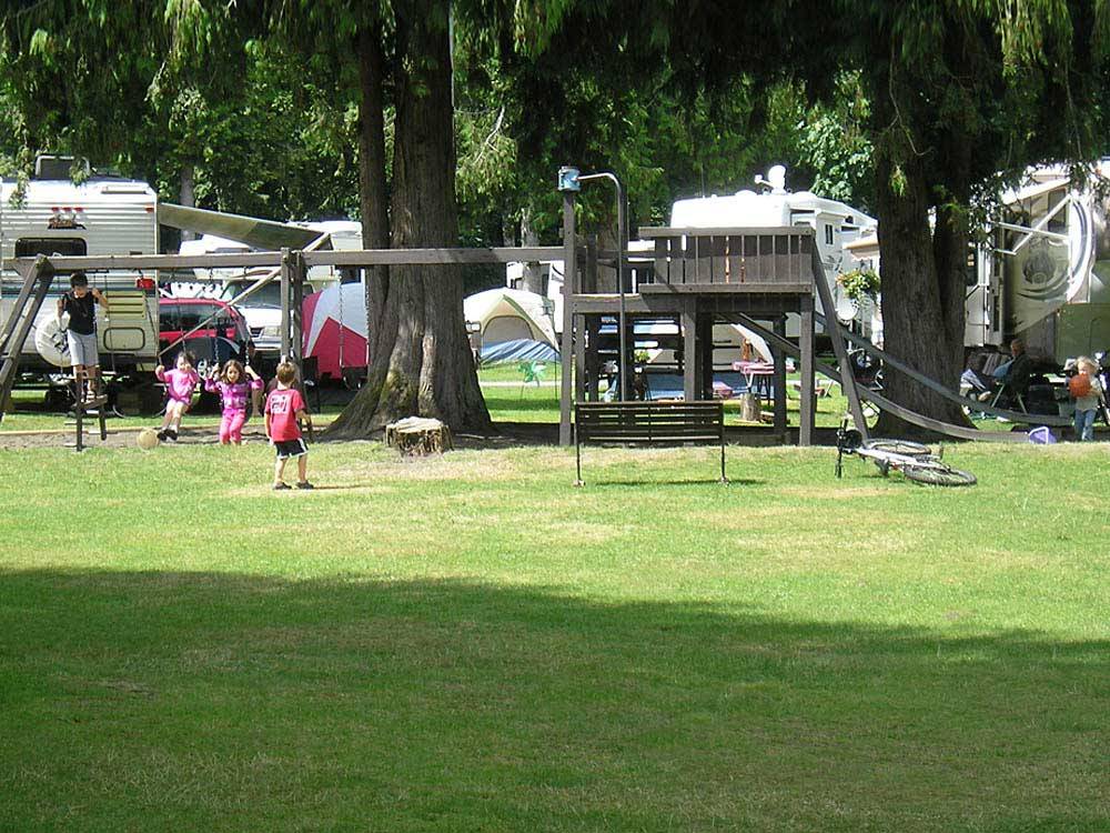 Playground with swing set at THOUSAND TRAILS CULTUS LAKE
