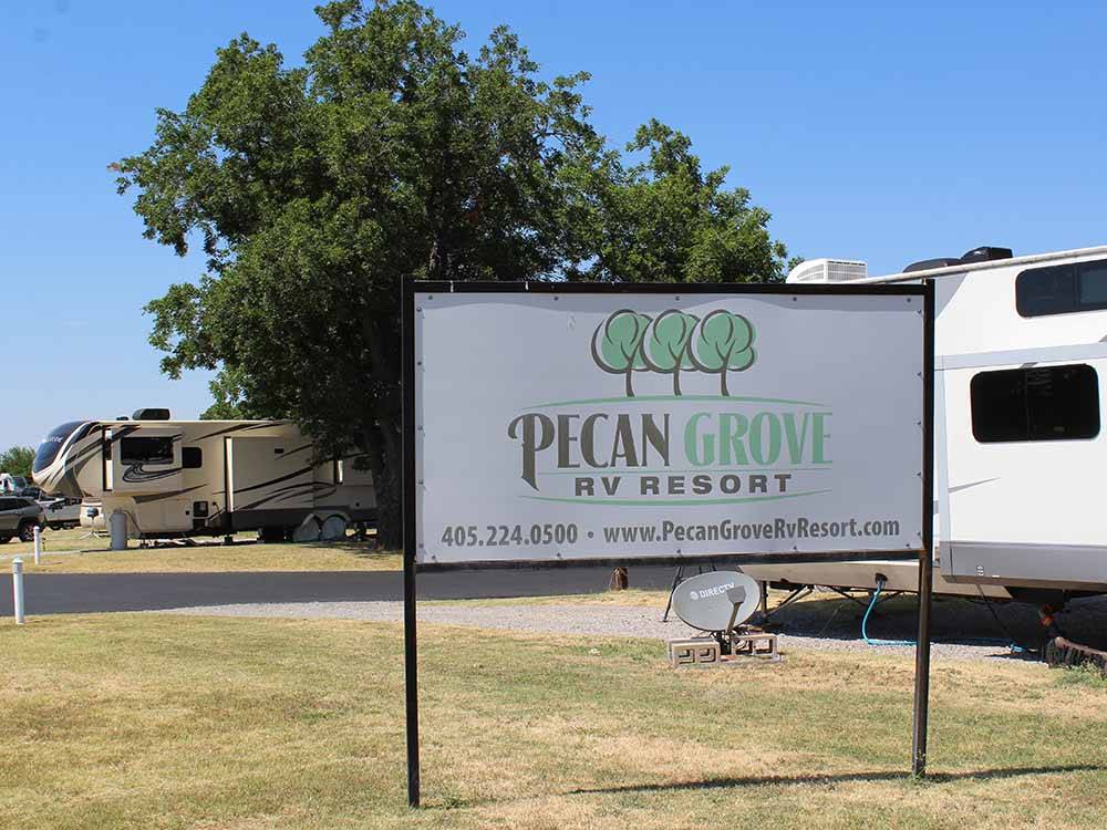 The front entrance sign at PECAN GROVE RV RESORT