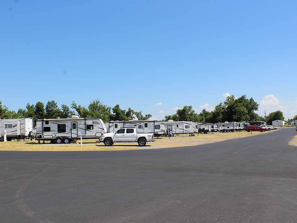 A group of RV sites with paved roads at PECAN GROVE RV RESORT