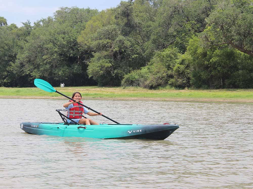 A young girl kayaking at BRACKENRIDGE RECREATION COMPLEX-TEXANA PARK & CAMPGROUND
