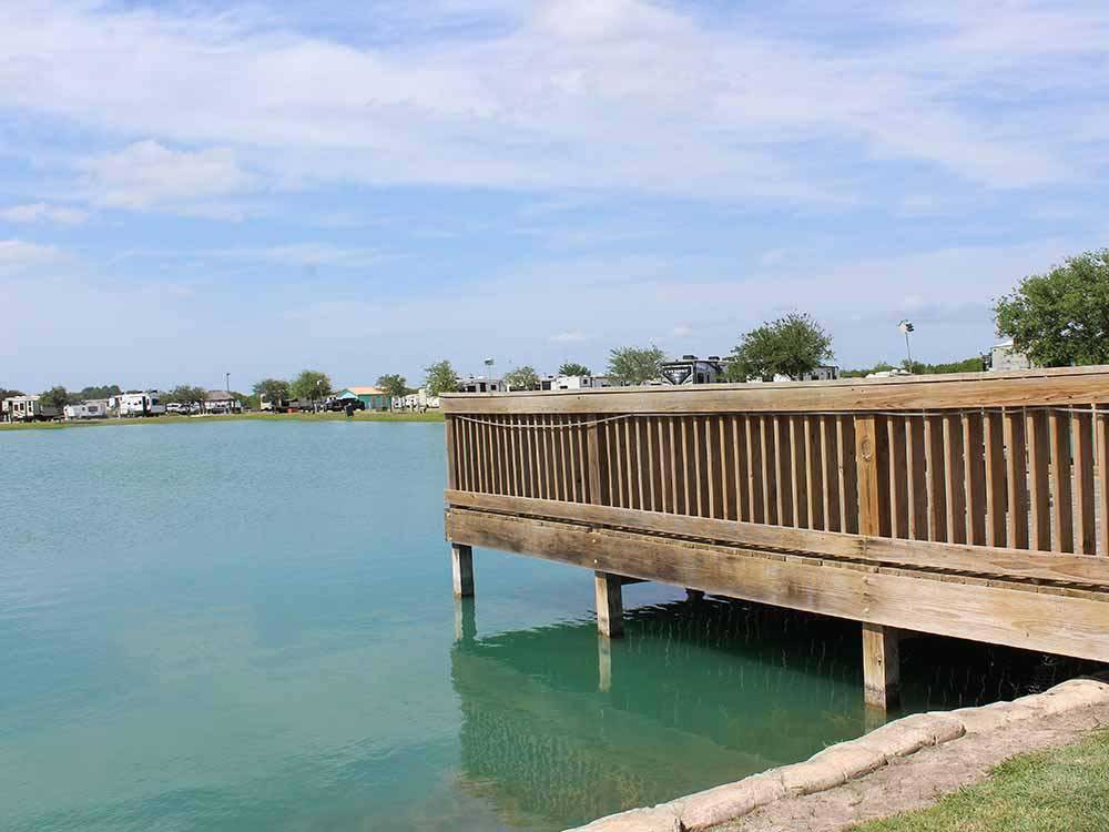 A wooden bridge in the lake at TEXAS LAKESIDE RV RESORT